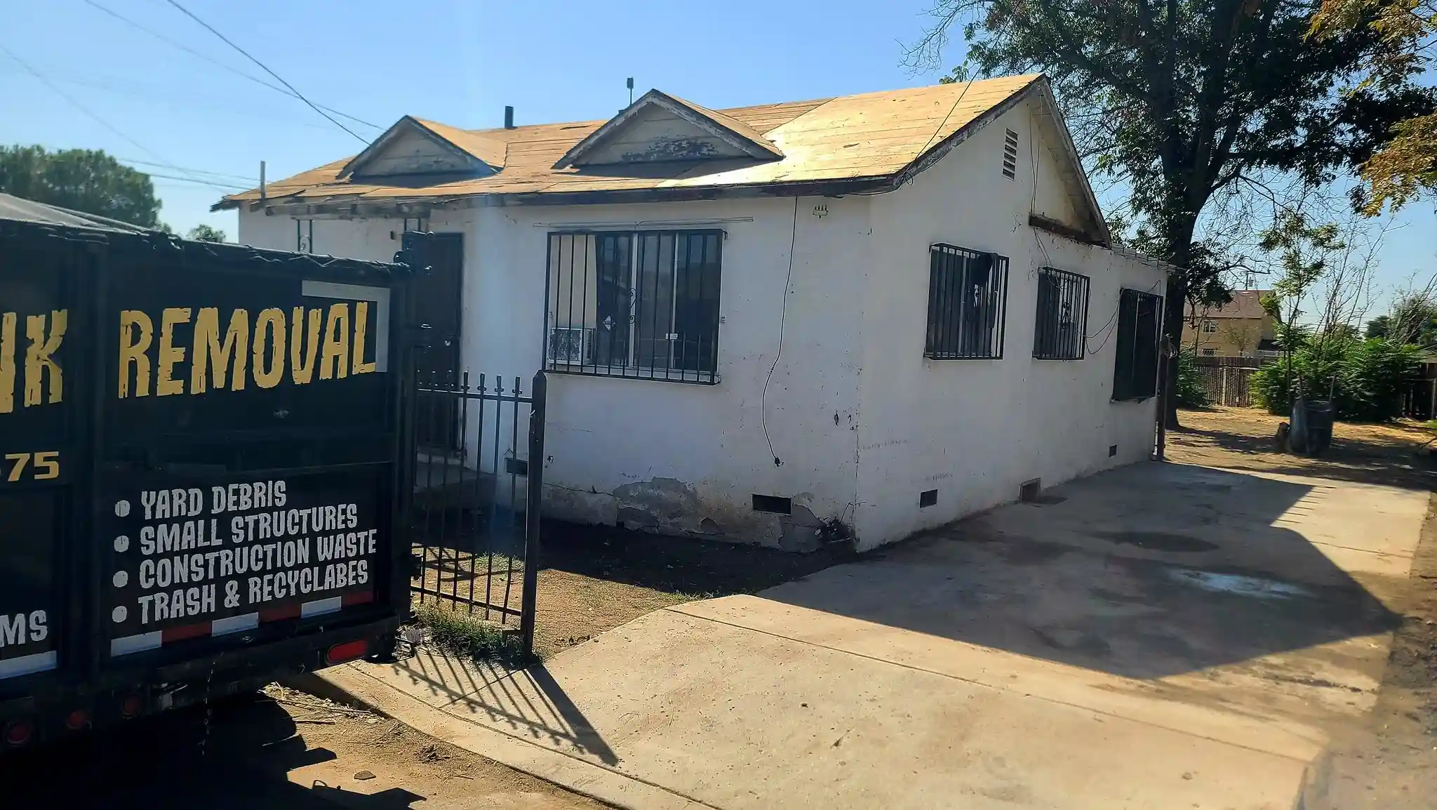 Golden Kern Junk Removal service crew and hauling vehicle in Bakersfield CA